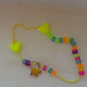 This bracelet has beads and little shaped hearts